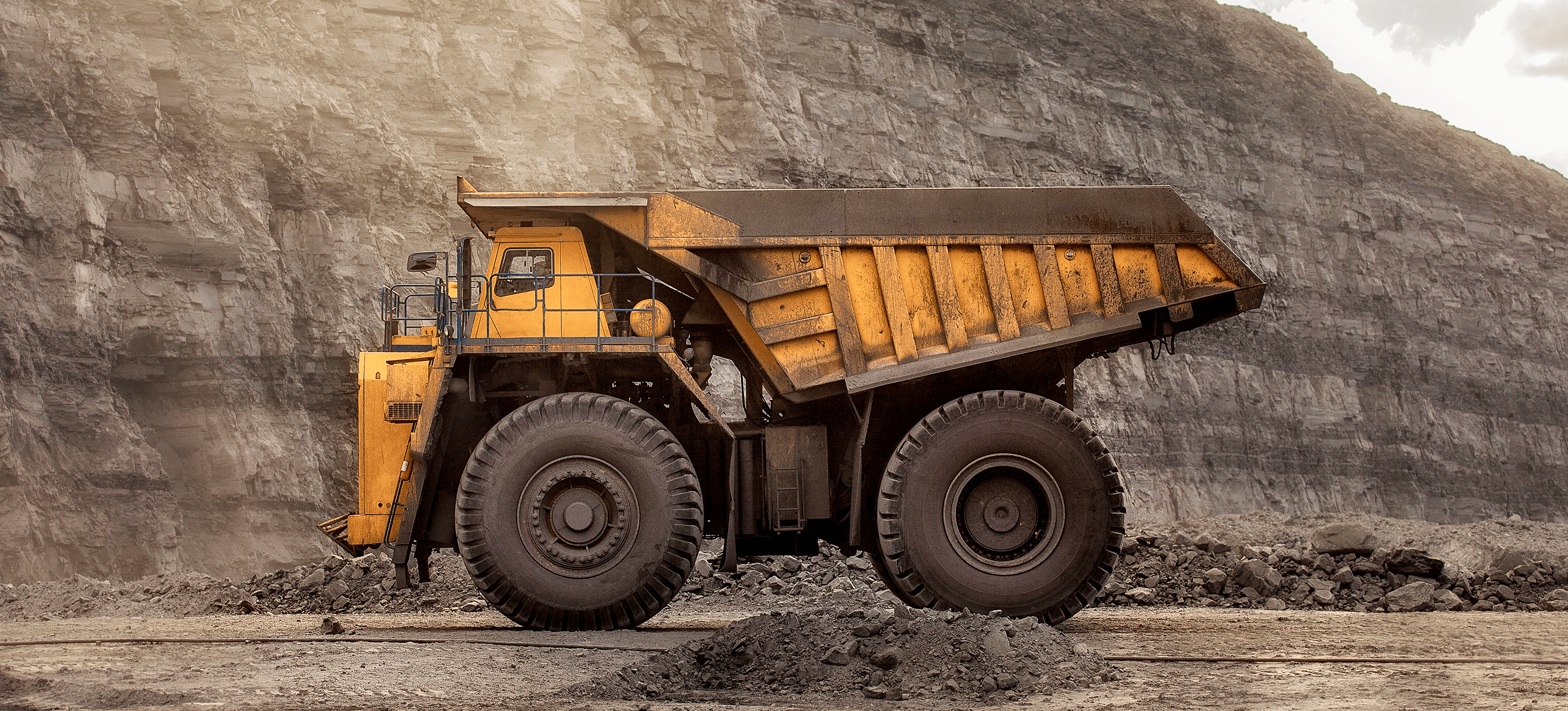 Large yellow mining vehicle in quarry